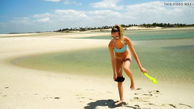 alice stretching naked at the beach