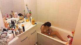 Hidden Cam. Can't stop texting even in the middle of a bath.