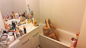 Hidden Cam. Can't stop texting even in the middle of a bath.